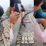 Viral Video: चलती ट्रेन के बाहर लटकता रहा शख्स, मदद की जगह वीडियो बनाते रहे लोग; वायरल क्लिप ने छेड़ी बहस