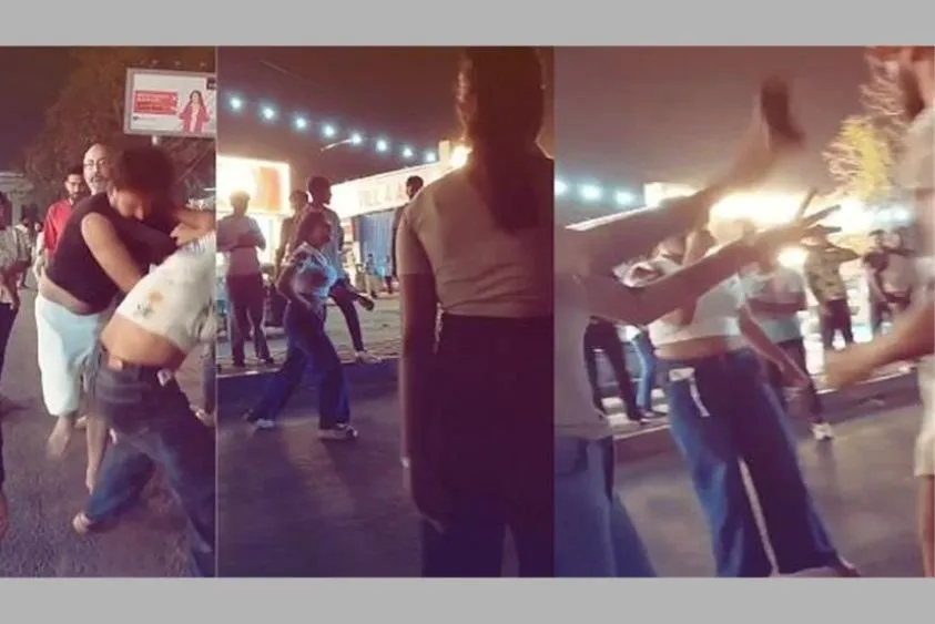  युवती और युवक के बीच सड़क पर चले लात-घूंसे, फाड़े युवक के कपड़े, वीडियो वायरल
